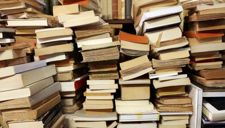 books piled up for sale in the great library