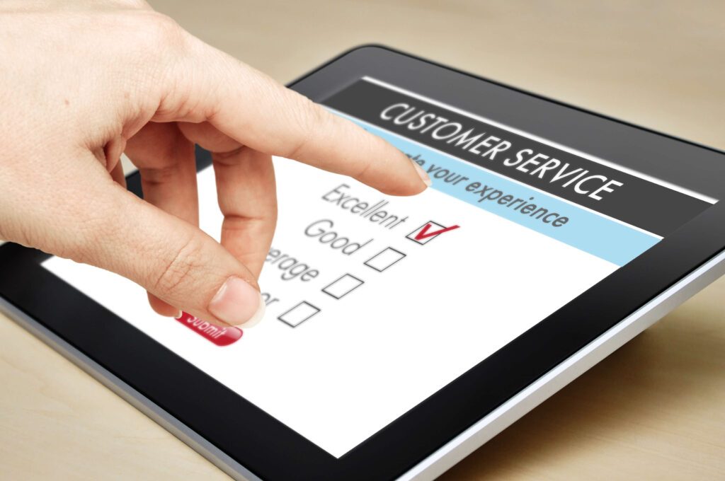 hand touching customer service survey on tablet device