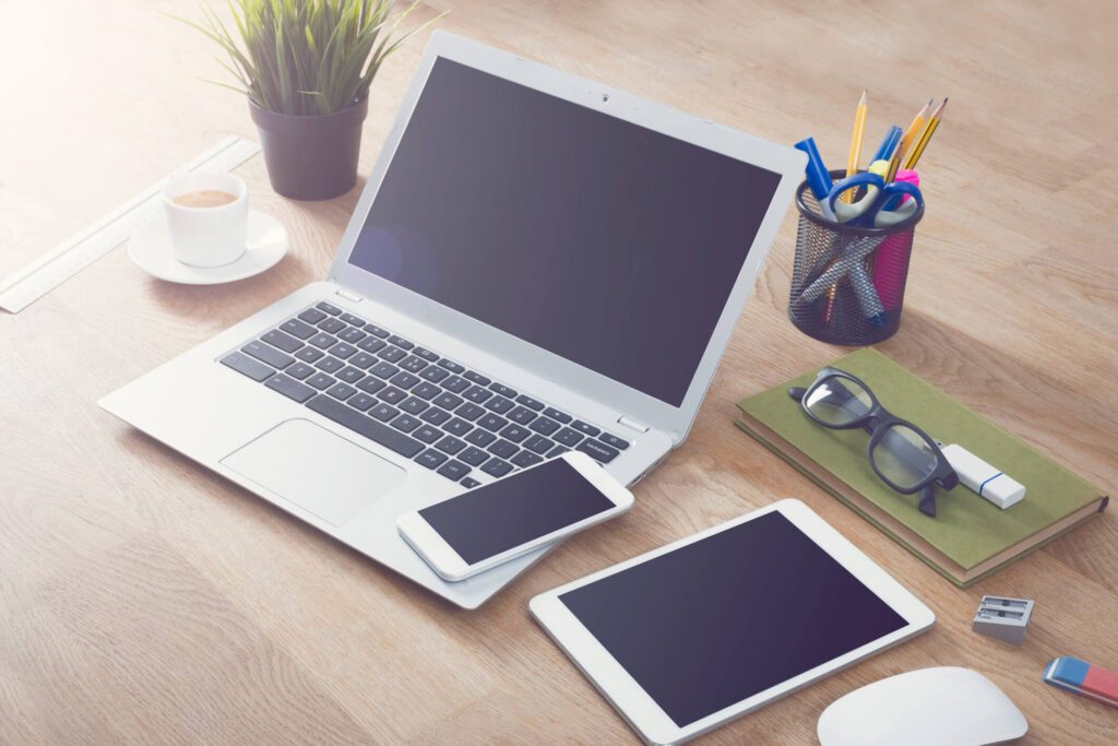 7 ways to transform your healthcare website redesign 6 laptop, tablet and mobile devices on desk