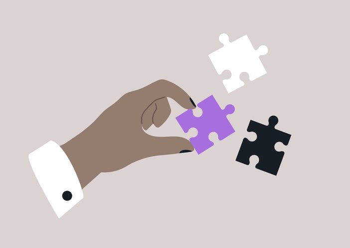 10 UX mistakes in SaaS that sabotage product marketing (and how to fix them) 6 A hand is skillfully selecting a vibrant puzzle piece from a collection of intriguing shapes and colors, perfectly enhancing the creative atmosphere of the moment