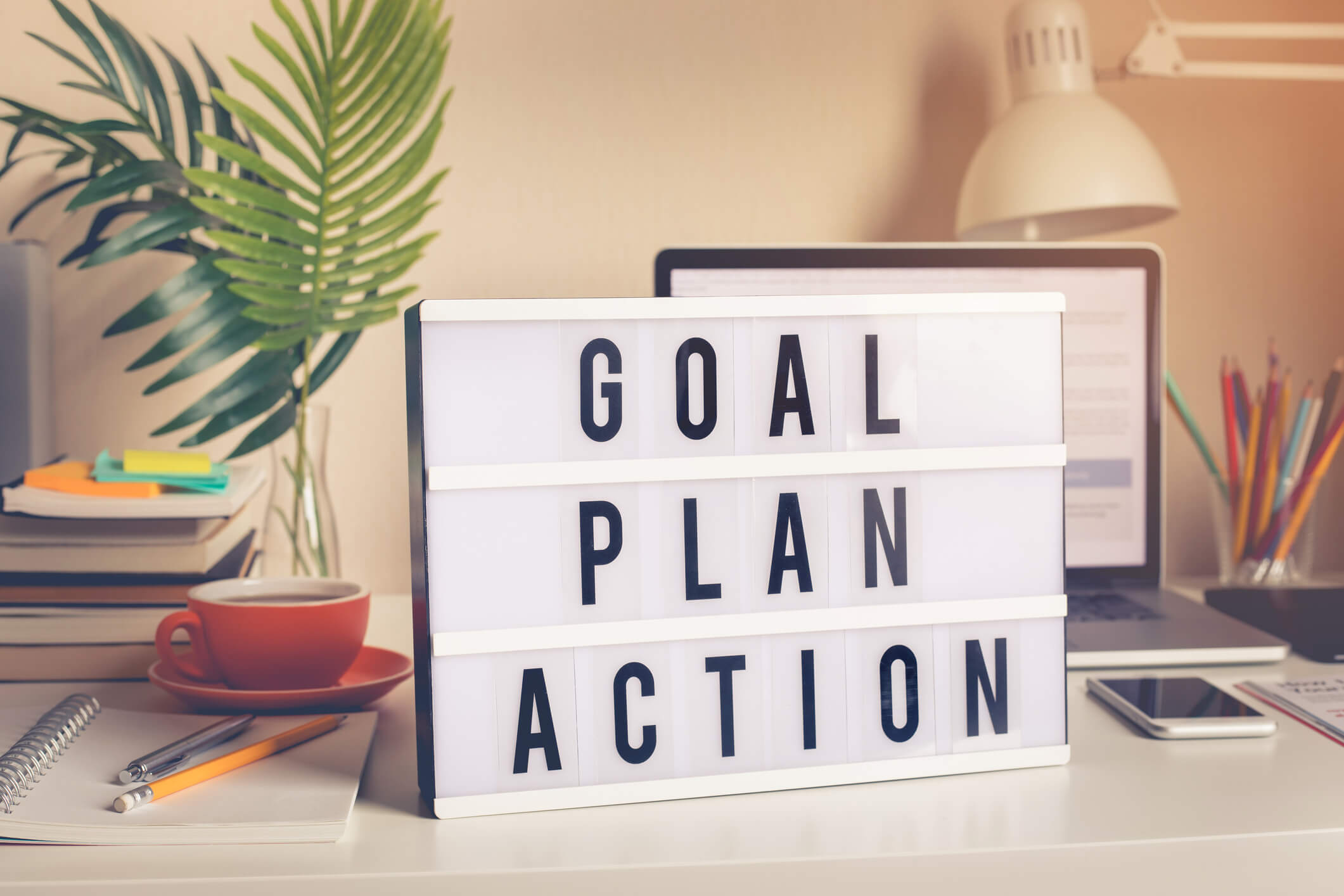Goal, plan, action text on light box on desk table in home office.Business motivation or inspiration,performance of human concepts ideas