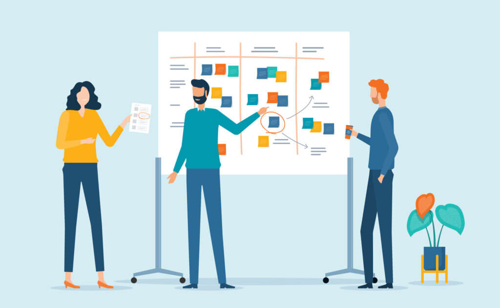 Illustration shows UX team at a whiteboard with sticky notes