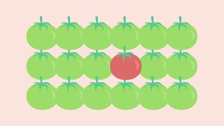 illustration shows one red tomato among multiple green tomatoes on pink background to illustrate psychology concept