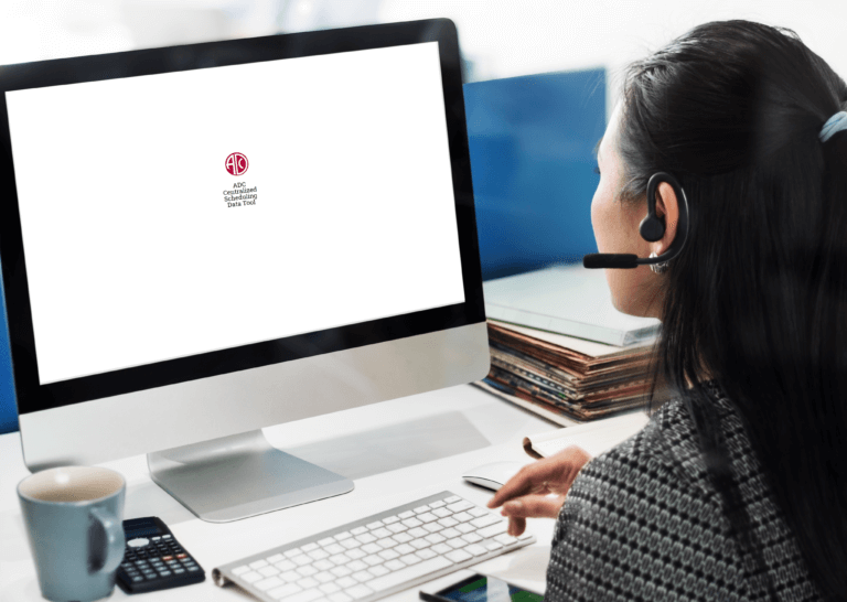 Healthcare scheduling tool design: Enhancing efficiency with digital rule management 14 women with phone earpiece using desktop screen with logo of tool