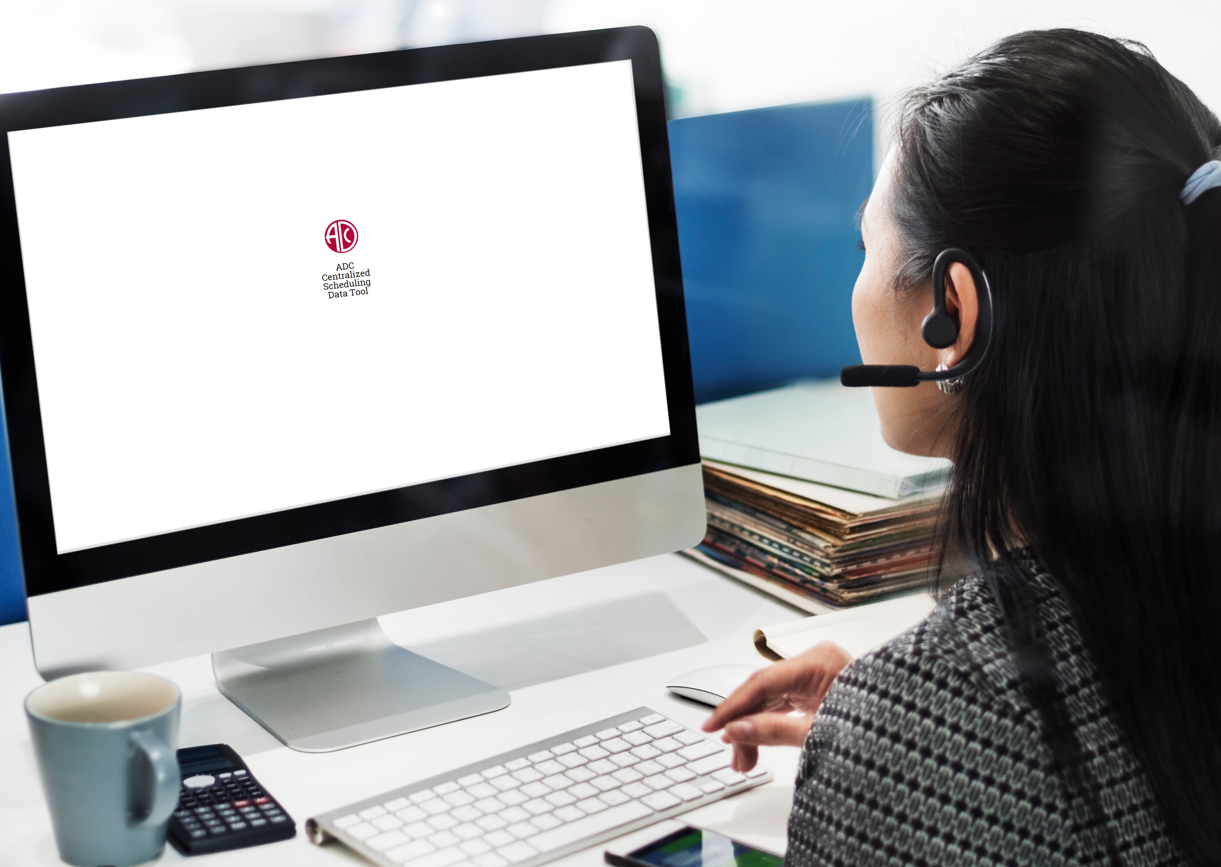 Healthcare scheduling tool design: Enhancing efficiency with digital rule management 1 women with phone earpiece using desktop screen with logo of healthcare scheduling tool
