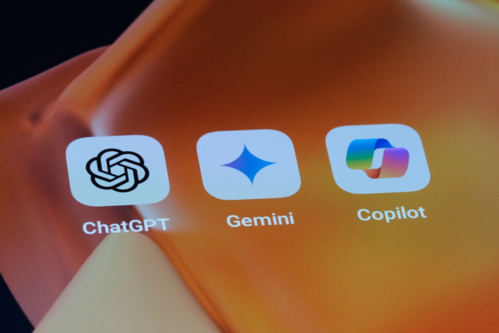 Microsoft Copilot free vs paid 3 Google Gemini, OpenAI ChatGPT and Microsoft Copilot app icons on screen for article on Microsoft Copilot free vs paid
